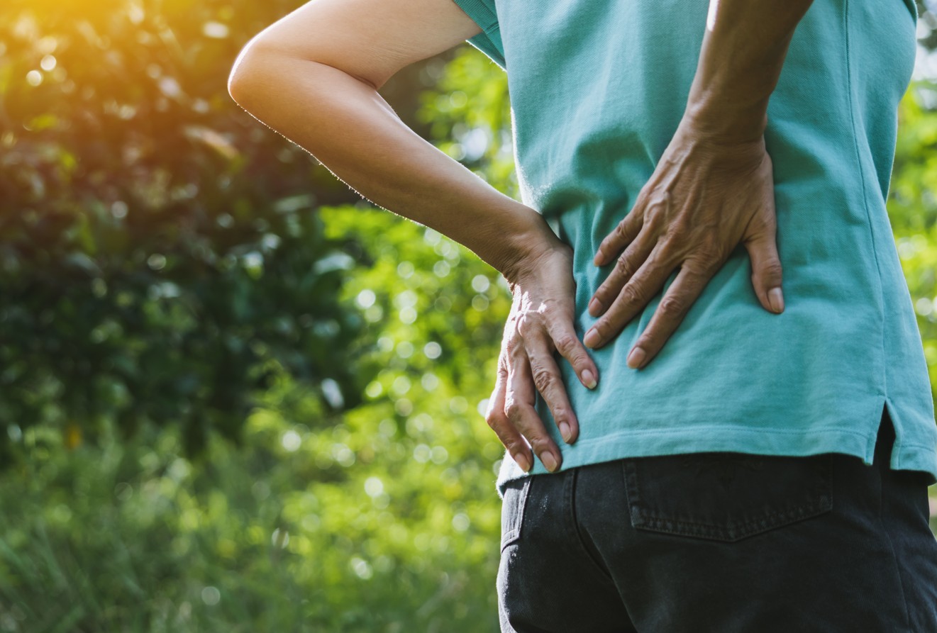 Sciatica is a symptom, not a diagnosis. It usually means the sciatic nerve—running from the lower back through the hips and down each leg—is being irritated or compressed somewhere along the way.